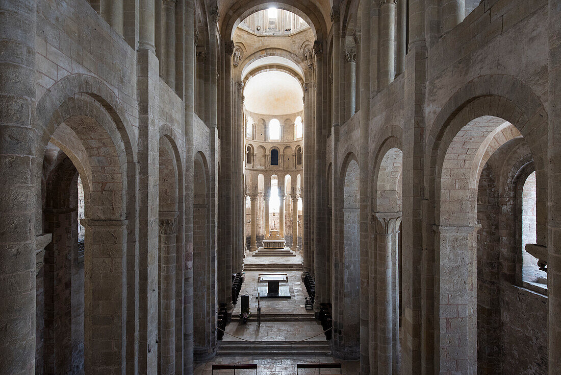 France, Aveyron, Conques, labeled the Most Beautiful Villages of France, Romanesque Abbey of Saint Foy from 11th Century, listed as World Heritage by UNESCO, contemporary stained glass window by Pierre Soulages, abbey interior\n