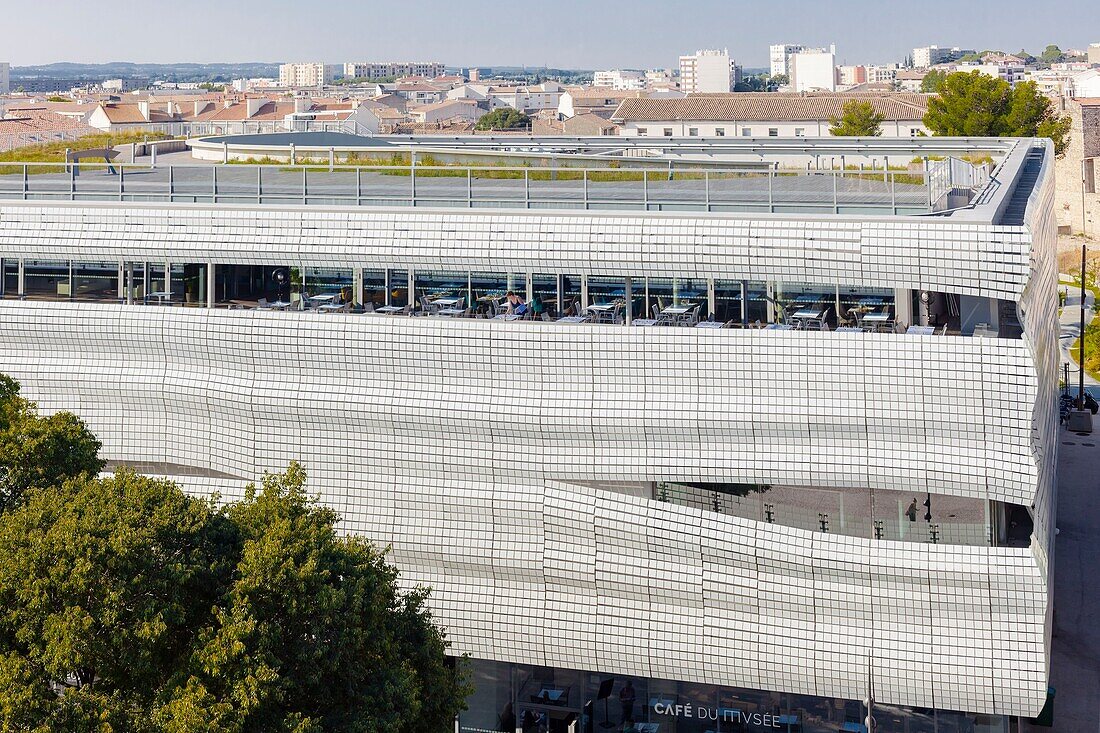 France, Gard, Nimes, Musee de la Romanite by architect Elizabeth de Portzamparc, elevated view of front façade, roof terrace and restaurant\n