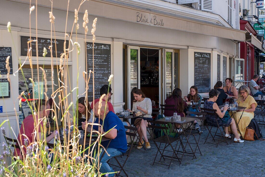 France, Paris, Charonne district, restaurant terrace on the Place Sainte-Blaise\n
