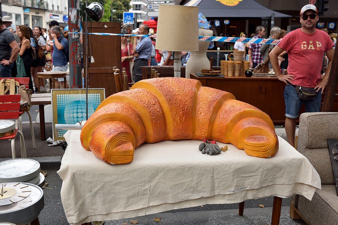 France, Nord, Lille, boulevard of Freedom, jumble sale 2019, molding representing a giant crescent on a table\n