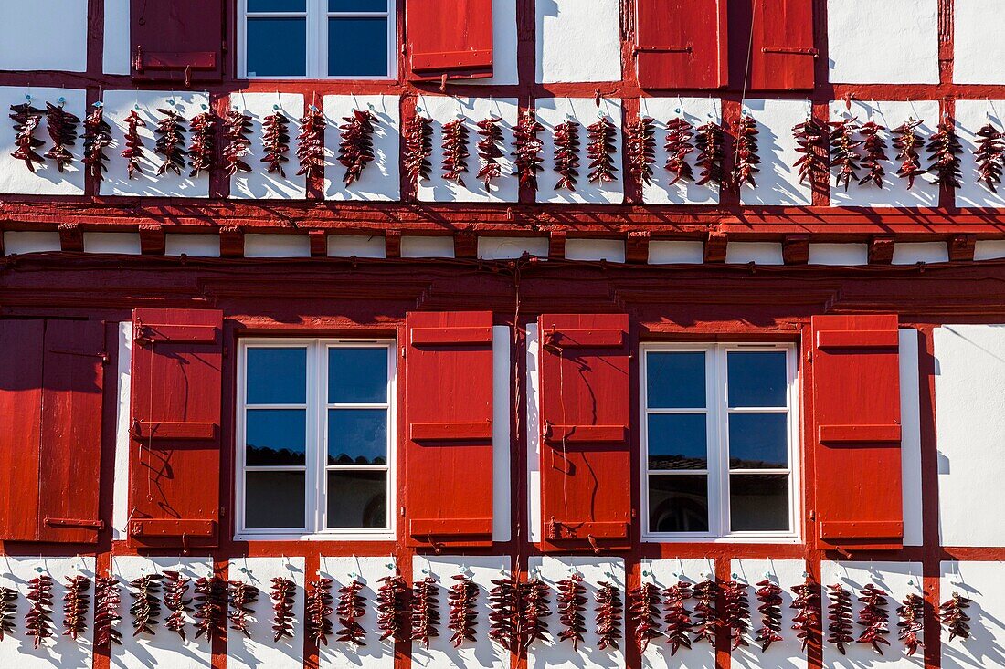 France, Pyrenees Atlantiques, Bask country (france), Espelette, traditional facade of the Basque country with dry peppers\n