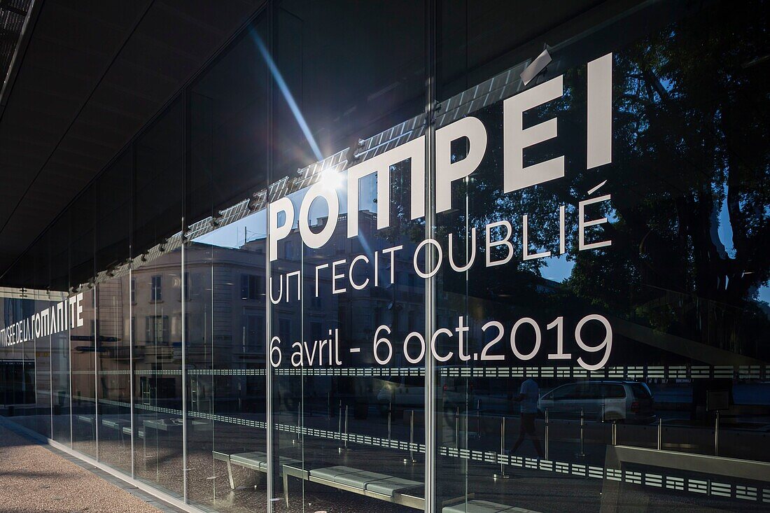 France, Gard, Nimes, Musee de la Romanite by architect Elizabeth de Portzamparc, front facade and announcement of the Pompeii exhibition\n