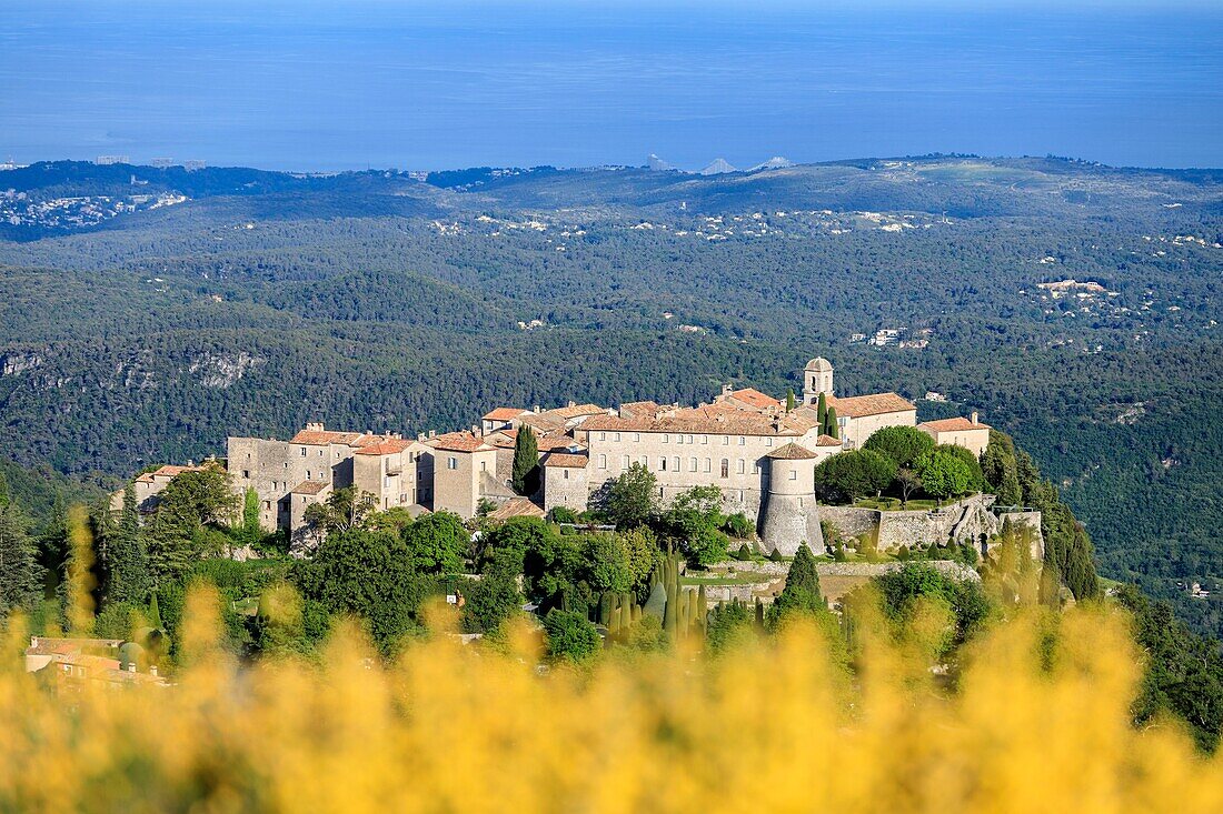 France, Alpes Maritimes, Parc Naturel Regional des Prealpes d'Azur, Gourdon, labeled Les Plus Beaux Villages de France, the coastline of the Côte d'Azur and the Marina Bay des Anges residence in the background\n