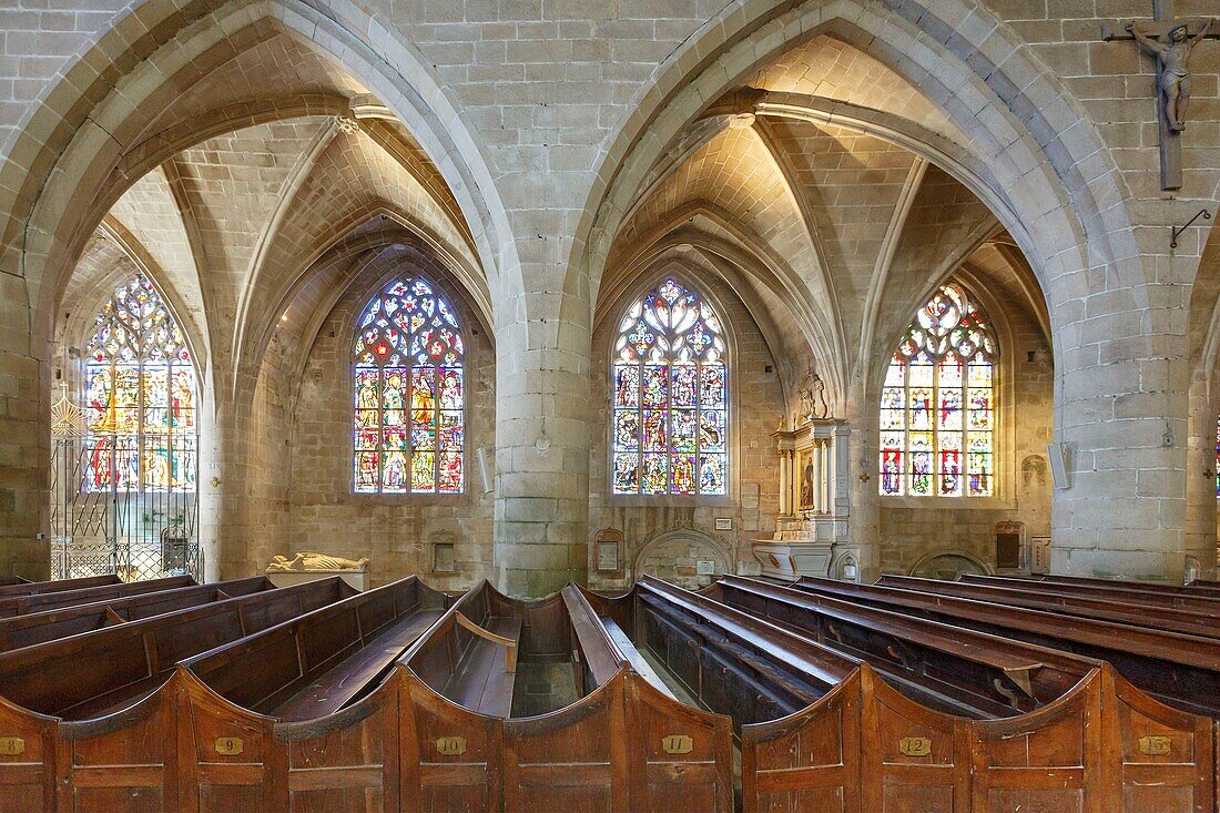 France, Cotes d'Armor, Dinan, Saint Sauveur of Dinan basilica, stained glass windows and benches in the nave\n