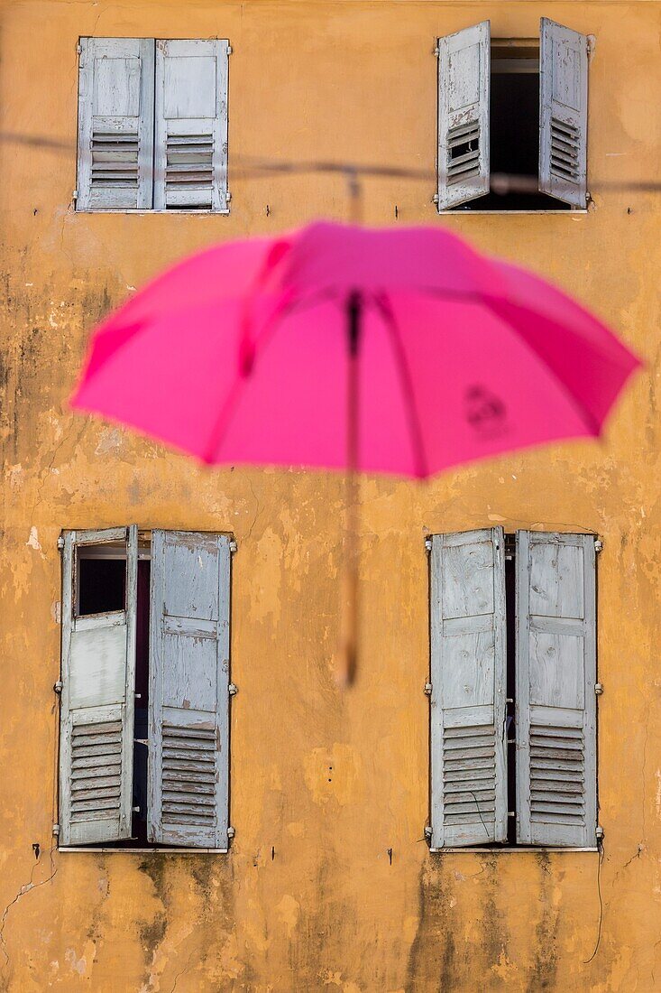 France, Alpes-Maritimes, Grasse, historic center, pink umbrella of the Place aux Aires\n