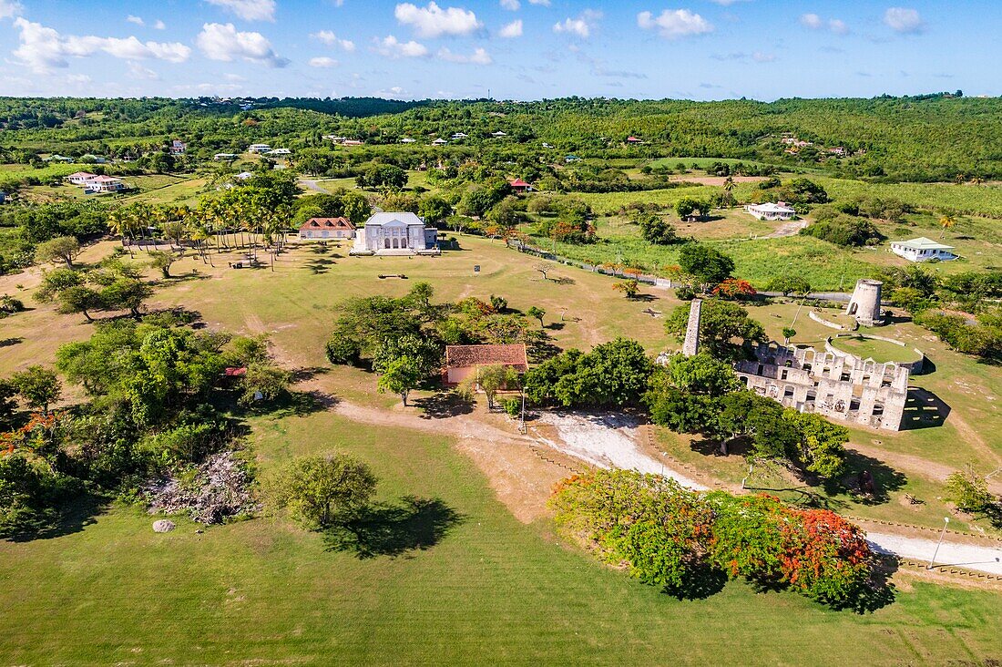 France, Caribbean, Lesser Antilles, Guadeloupe, Marie-Galante, Grand-Bourg, aerial view of Habitation Murat, sugar plantation founded in 1657, whose windmill is built in 1814 for the mechanical exploitation of the crushing of the sugar cane\n