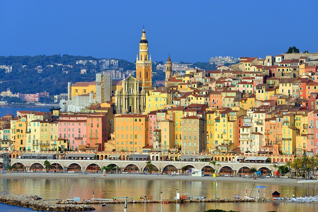 France, Alpes Maritimes, Cote d'Azur, Menton, the beach and the old town dominated by the Saint Michel Archange basilica\n