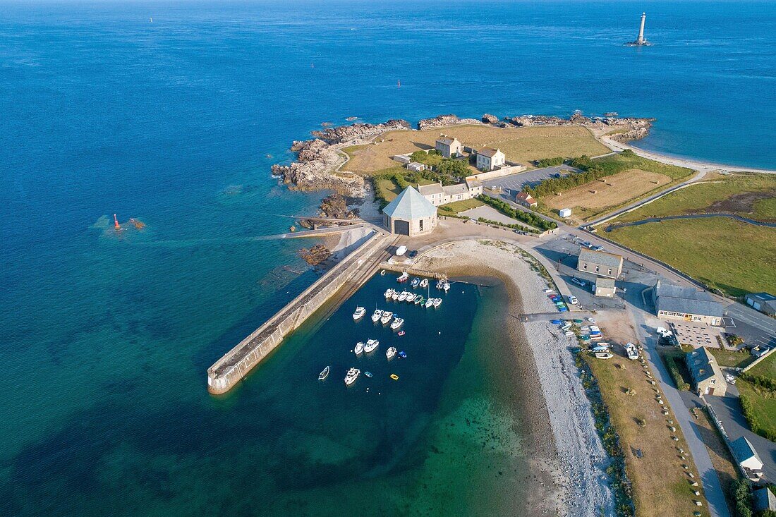 France, Manche, Cotentin, Cap de la Hague, Auderville, Goury harbour and the octogonal sea rescue station, Goury lighthouse in the background (aerial view)\n