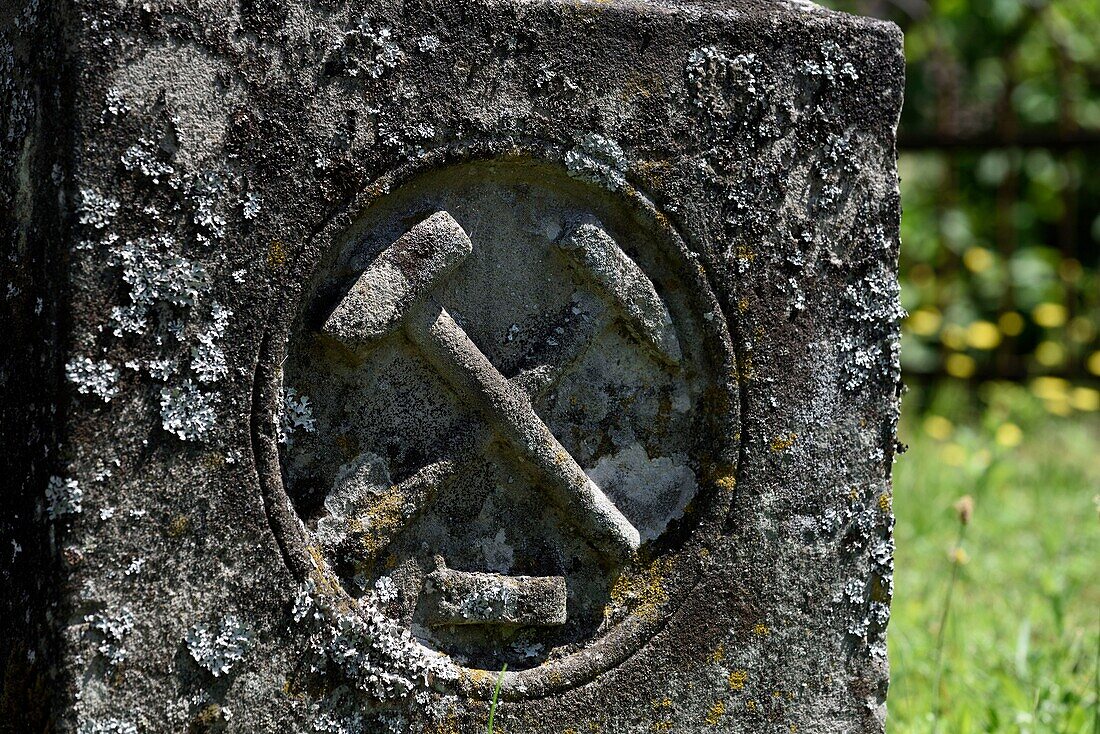 France, Haut Rhin, Sainte Marie aux Mines, Saint Pierre sur-L Hate, church, cemetery next to church, grave, miners emblems, hammer and pointerolle\n