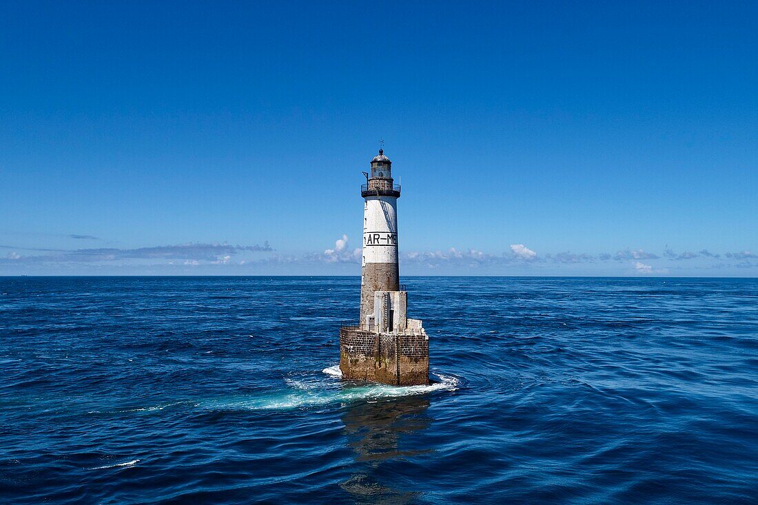 France, Finistere, Iroise Sea, Iles du Ponant, Parc Naturel Regional d'Armorique (Armorica Regional Natural Park), Ile de Sein, Chaussee de Sein, Ar Men Lighthouse (aerial view)\n