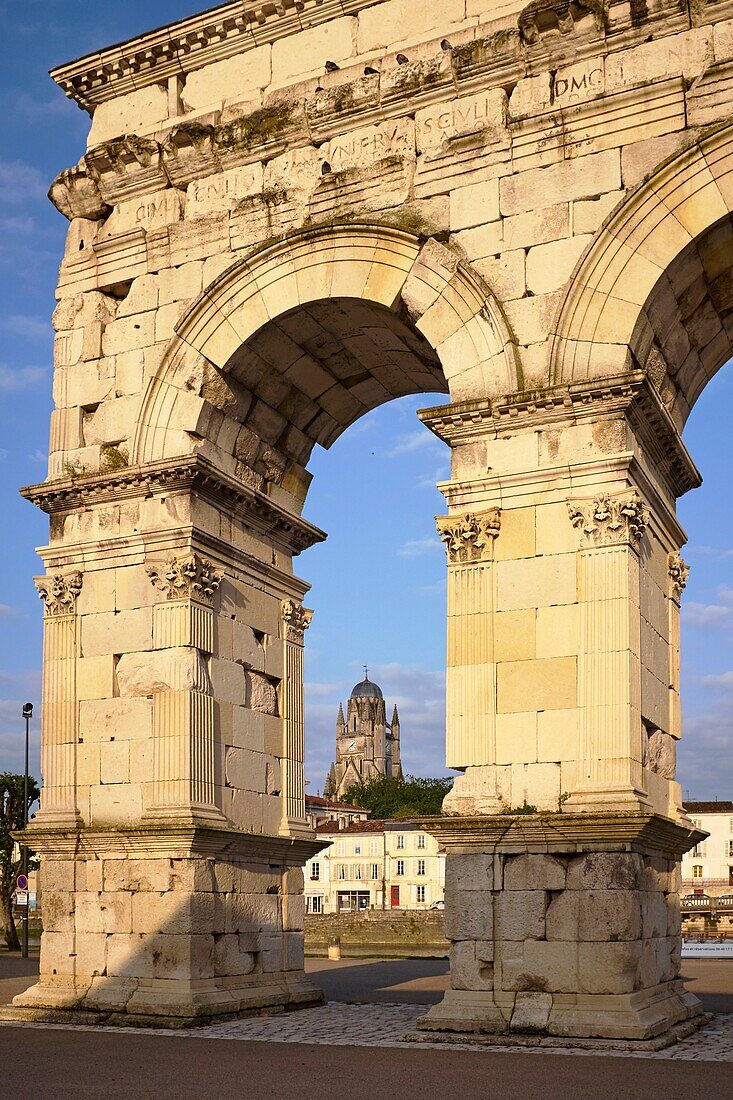 France, Charente Maritime, Saintonge, Saintes, the Arch of Germanicus built around 18-19 AD dedicated to the emperor Tiberius and St. Peter Cathedral in the background\n