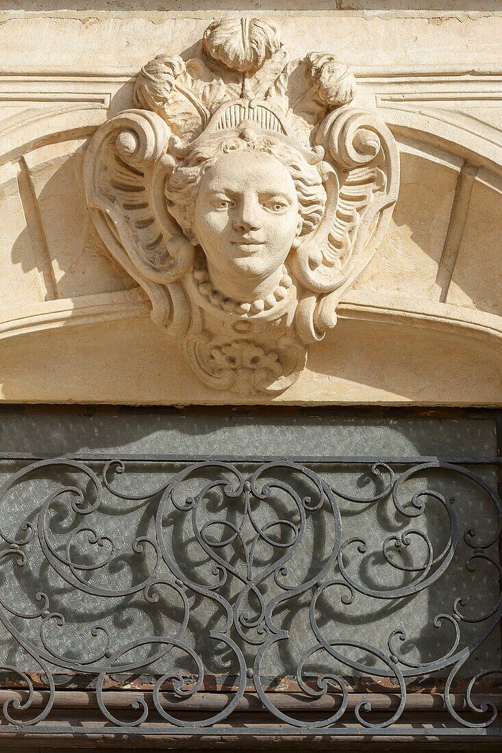 France, Meurthe et Moselle, Nancy, detail of a sculped face on the facade of a house\n