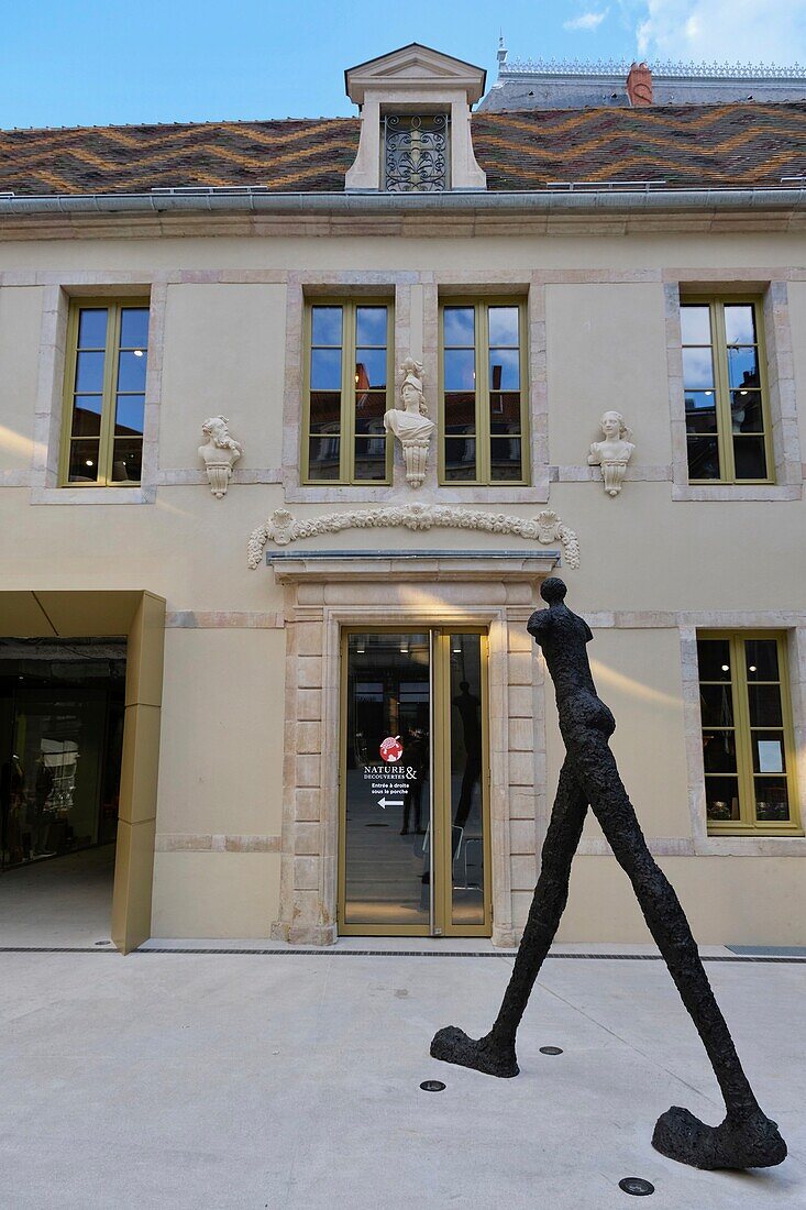 France, Cote d'Or, Dijon, area listed as World Heritage by UNESCO, Cour Bareuzai shopping arcade in the former Hotel des Godrans dating from the 15th century, statue of the artist Nathalie Decoster, La Trace du Temps\n
