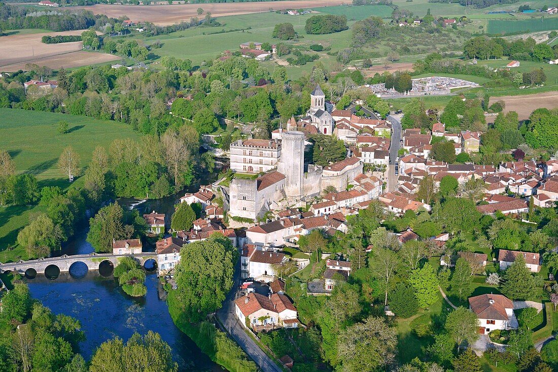 France, Dordogne, Perigord Vert, Bourdeilles, the castle overlooking the village and the Dronne river (aerial view)\n