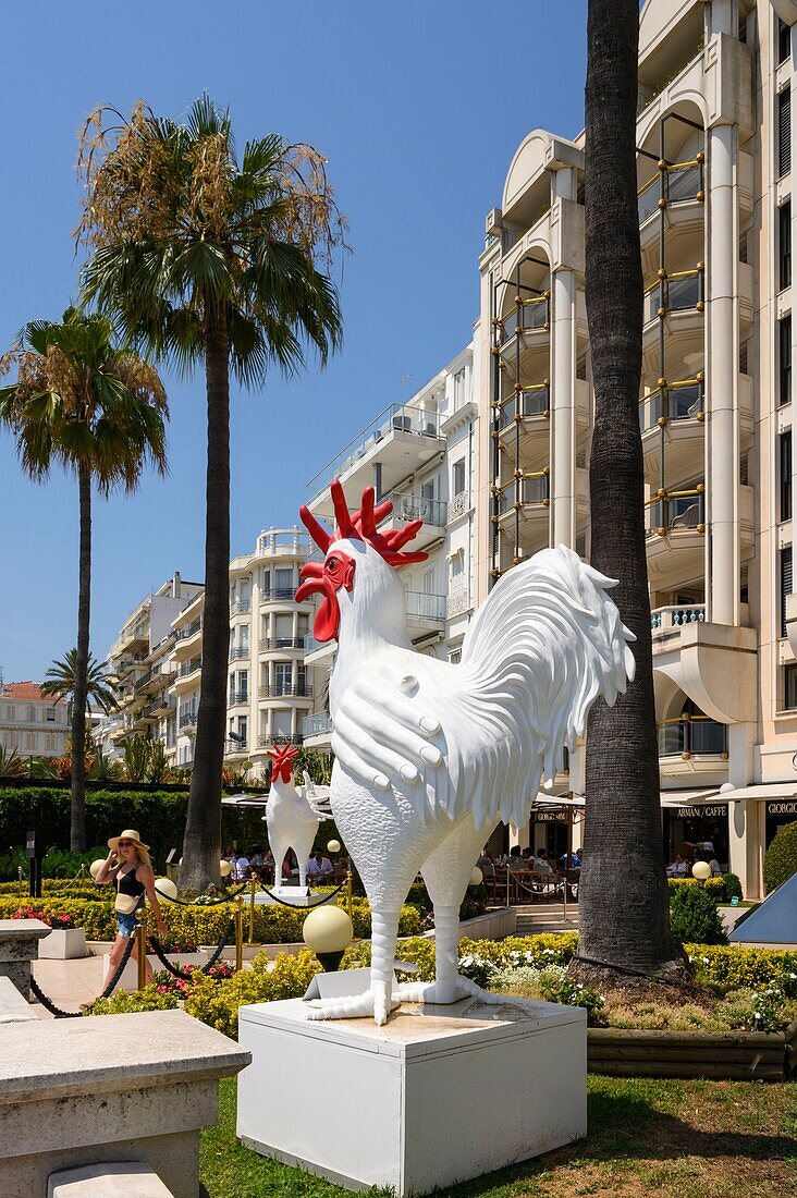 France, Alpes-Maritimes , Cannes, La Croisette, Sculptures in front of luxury shops\n