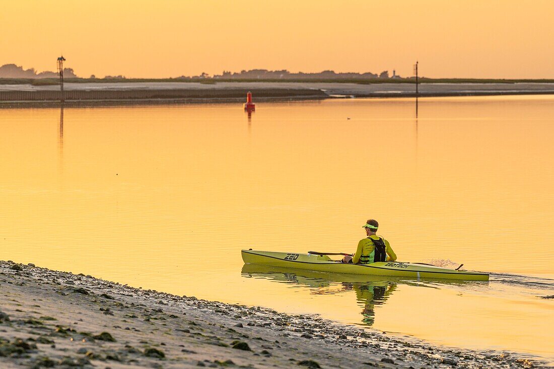 France, Somme, Somme Bay, Saint Valery sur Somme, Cape Hornu, return of a kayak in the channel of the Somme at sunset\n