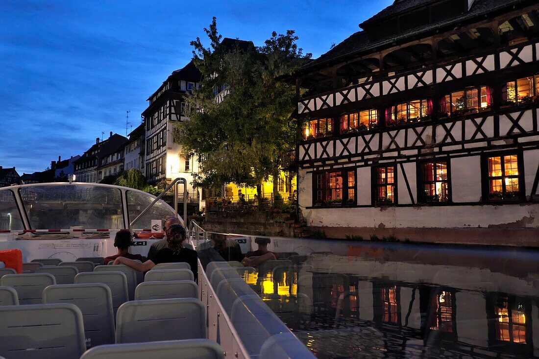 France, Bas Rhin, Strasbourg, old town listed as World Heritage by UNESCOvisit by boat on the Ill river, La Petite France, Maison des Tanneurs, swing bridge, summer evening\n