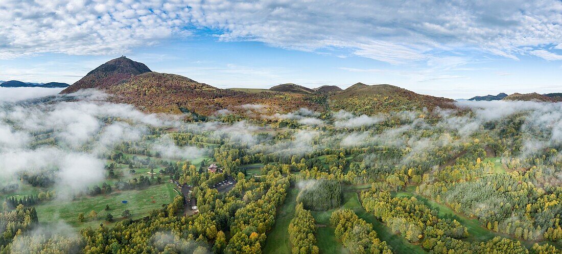 France, Puy de Dome, Orcines, Regional Natural Park of the Auvergne Volcanoes, the Chaîne des Puys, listed as World Heritage by UNESCO, the Puy de Dome volcano (aerial view)\n