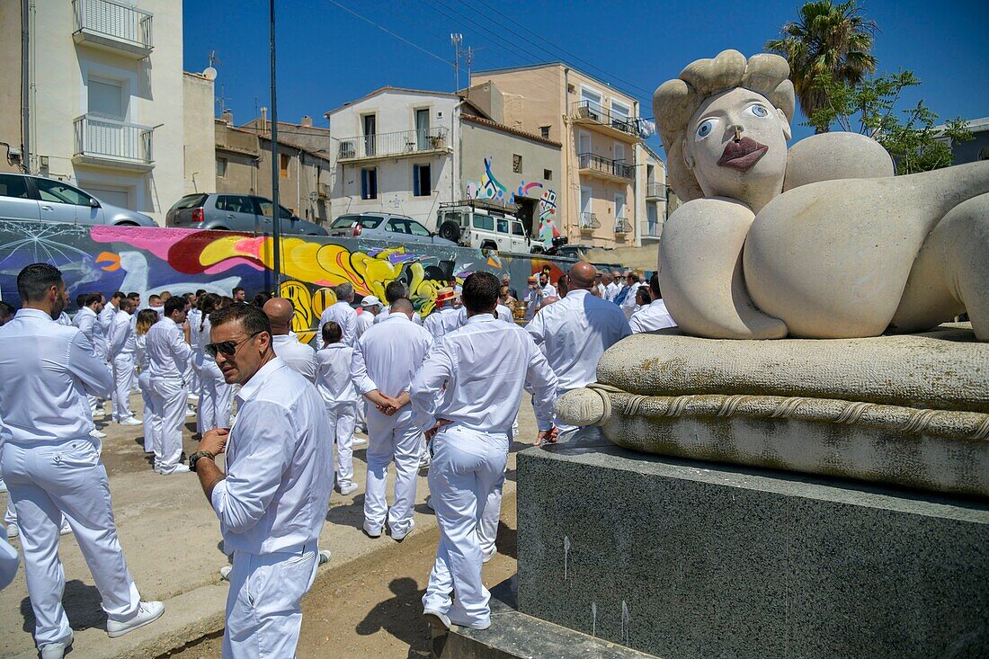 France, Herault, Sete, Quartier Haut, gathering of players during the festivities of Saint Pierre with the sculpture La Mama by the artist Hervé di Rosa on the right\n