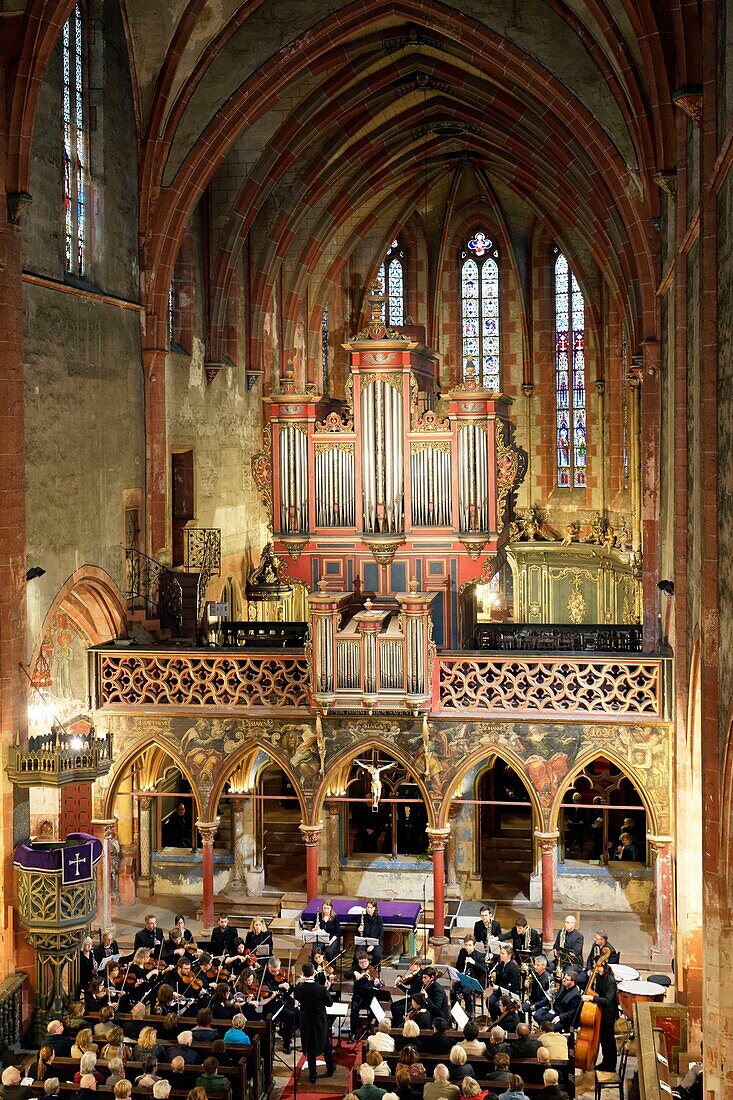 France, Bas Rhin, Strasbourg, old city listed as World Heritage by UNESCO, Saint Pierre le Jeune protestant church, jube of the 14th century surmounted of an organ Silberman (1780), Concert of the Jonas orchestra\n