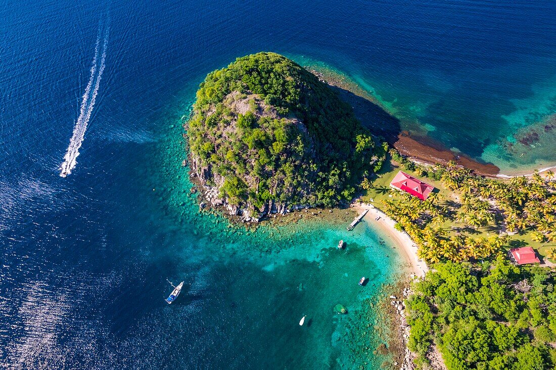 Guadeloupe, Les Saintes, Terre de Haut, the bay of the town of Terre de Haut, listed by UNESCO among the 10 most beautiful bays in the world, here the Pain de Sucre (aerial view)\n