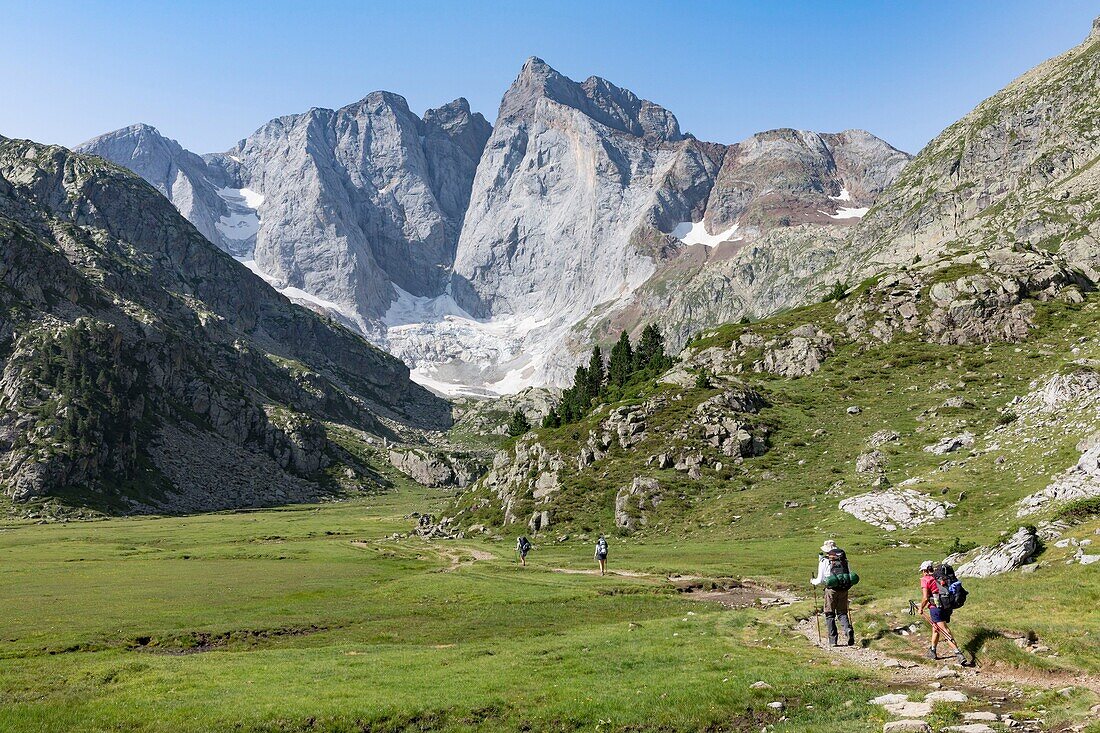 France, Hautes Pyrenees, Cauterets, Gaube valley, hikers on the trail to the Vignemale peak 3298 m\n