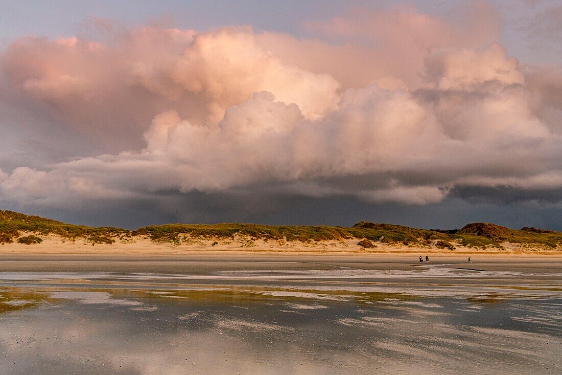 France, Somme, Quend-Plage, a stormy sky settles gradually over the beach at dusk, with special lights\n