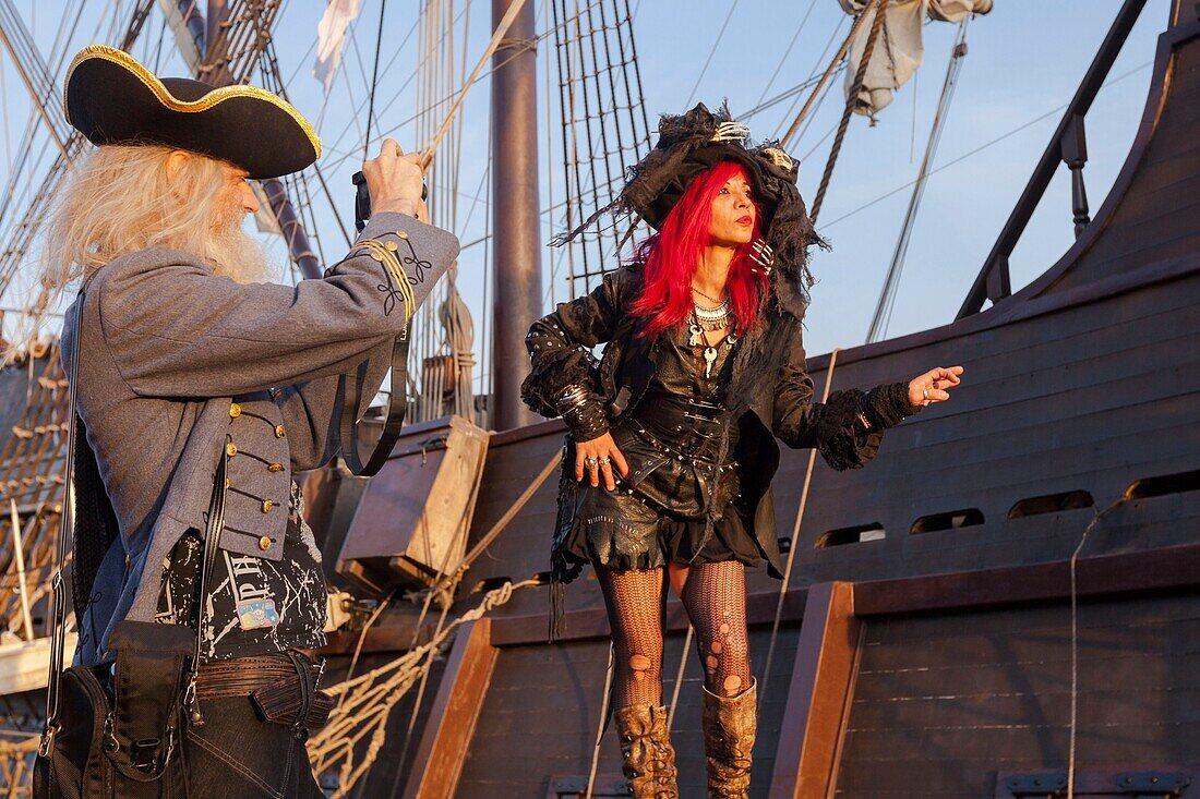 France, Seine Maritime, Rouen, Armada 2019, cosplay pirate couple photographing themselves in front of El Galeon\n