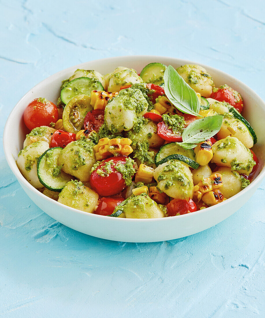 Vegan gnocchi with zucchini, sweetcorn, croutons and pesto