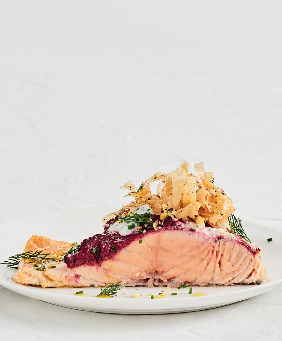 Baked beetroot topped salmon with crispy filo topping