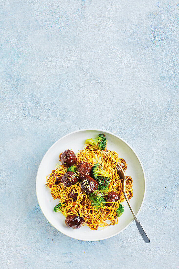 Mongolian beef meatballs with chow mein noodles and sesame seeds