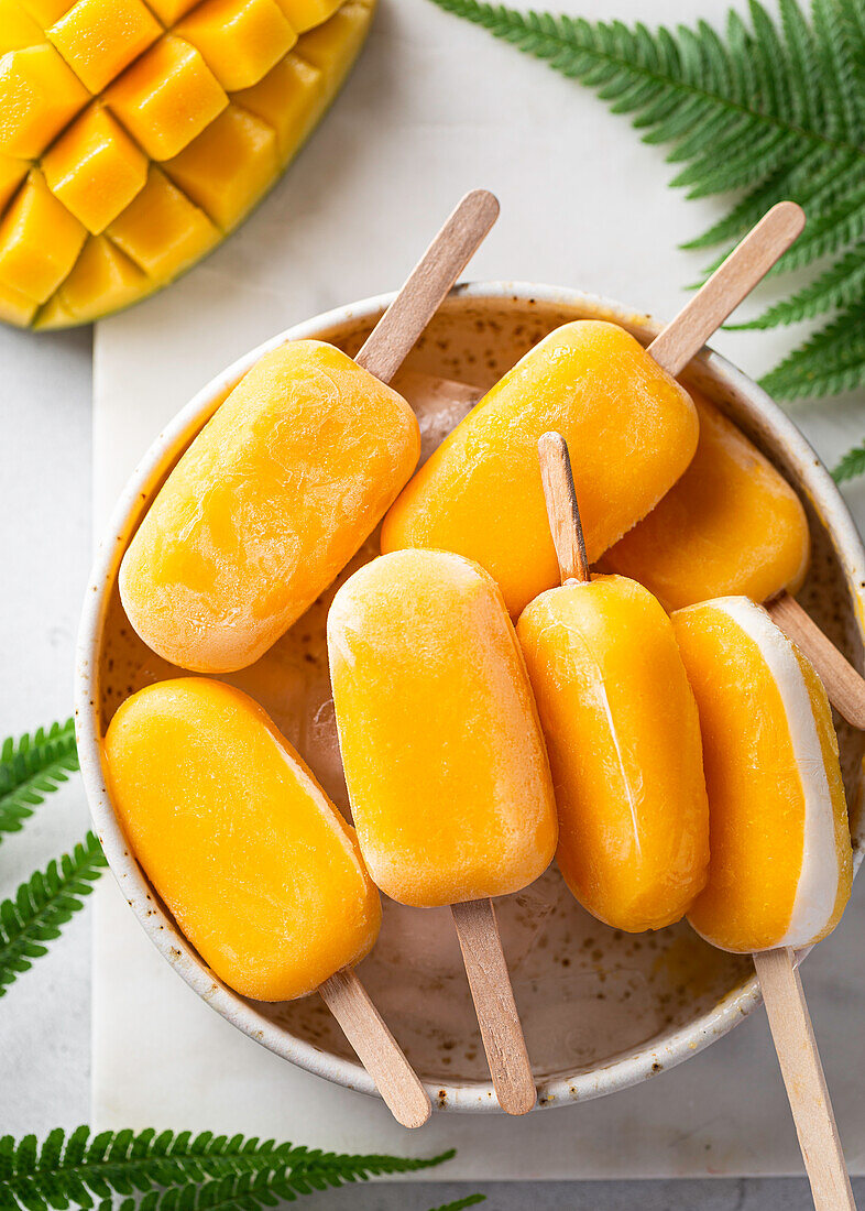 Mango ice cream pops with creamy coconut filling