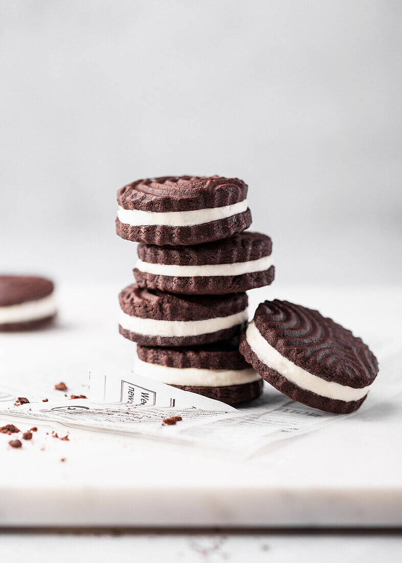 Stack of chocolate sandwich cookies with cream filling