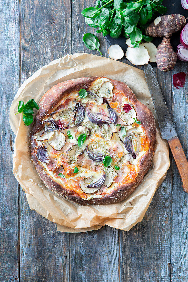 Jerusalem artichoke pizza Bianca with bacon and onions