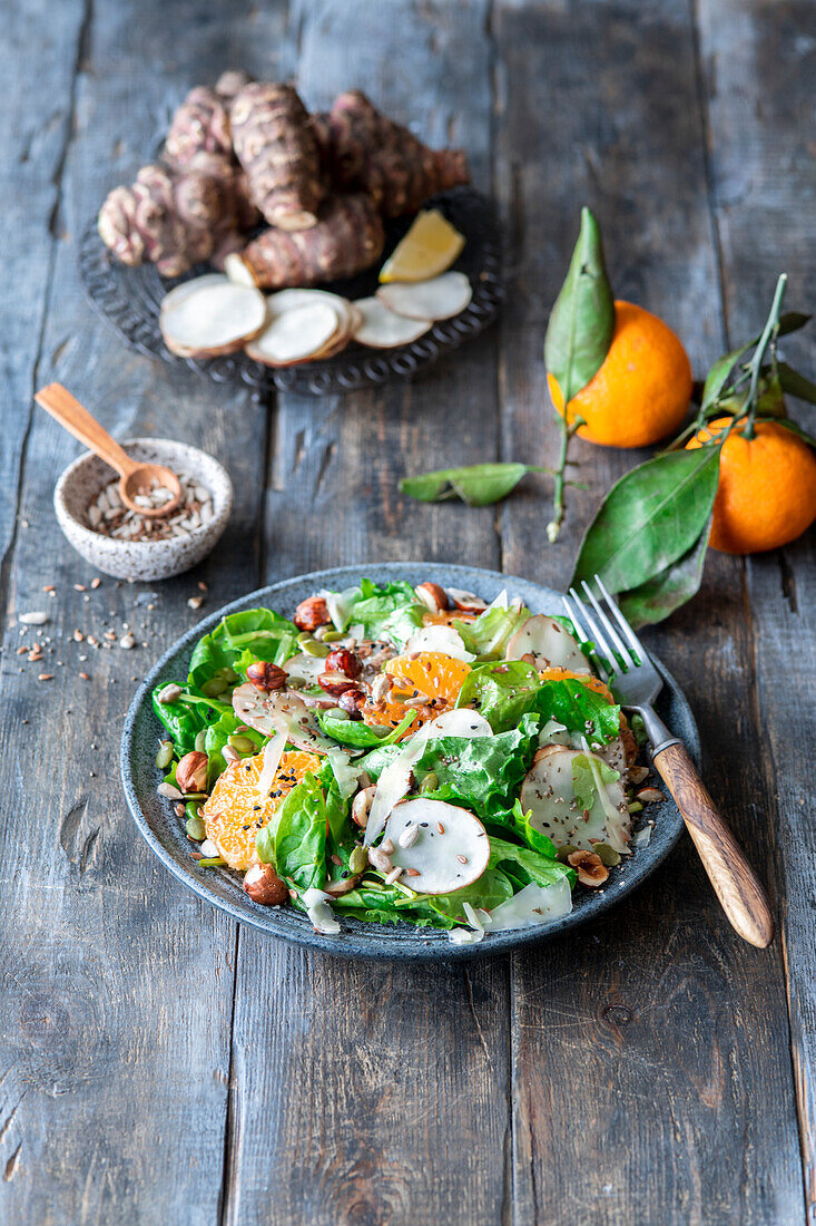 Jerusalem artichoke salad with mandarins and hazelnuts