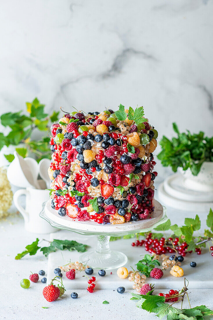Cream cake decorated with summer berries