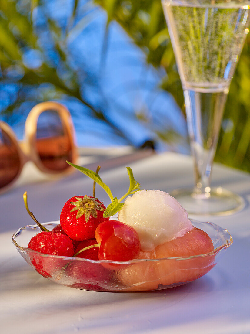 Peach with sorbet, strawberries and cherries