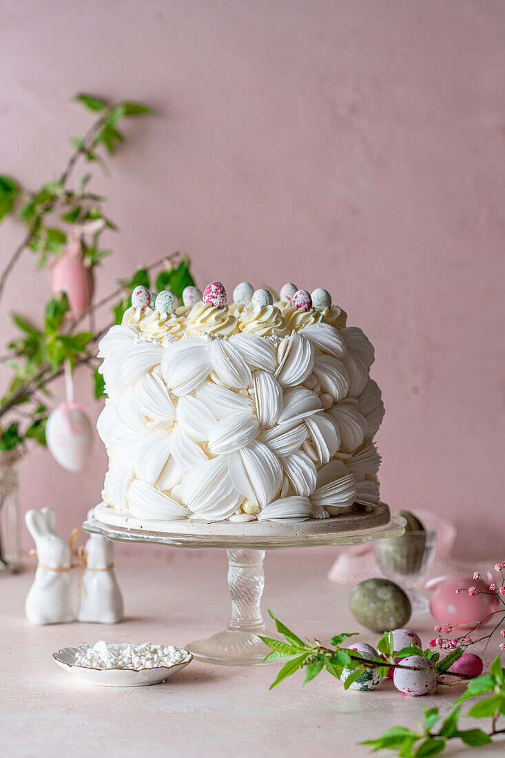 Raspberry cake with edible paper decoration and sugar eggs