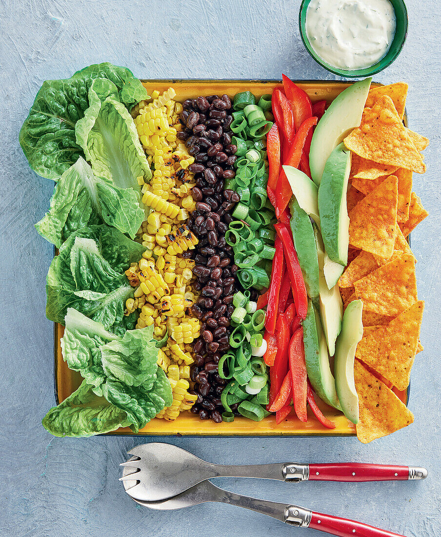 Chopped Mexican taco salad with sweetcorn and avocado