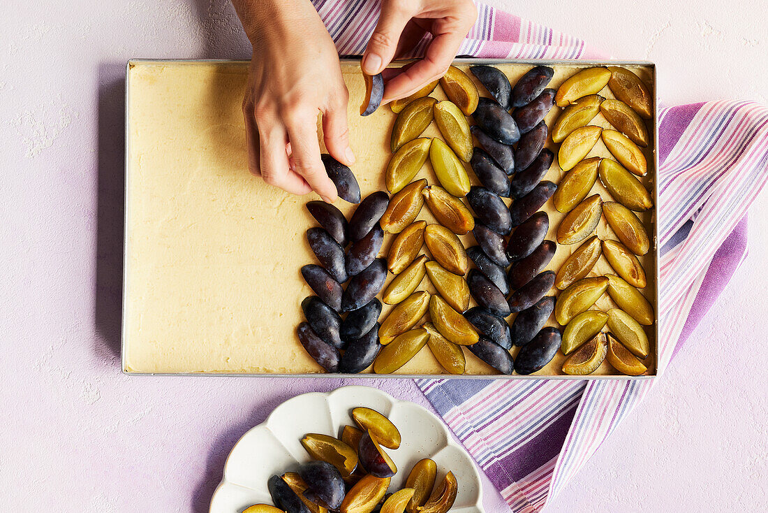 Topping French plum tart