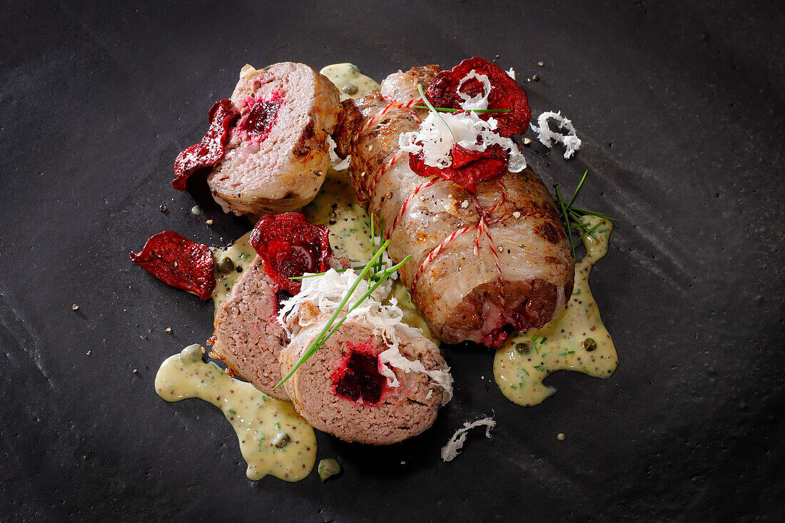 Minced beef rolls with lardo, baked beetroot and horseradish in a mustard sauce with capers