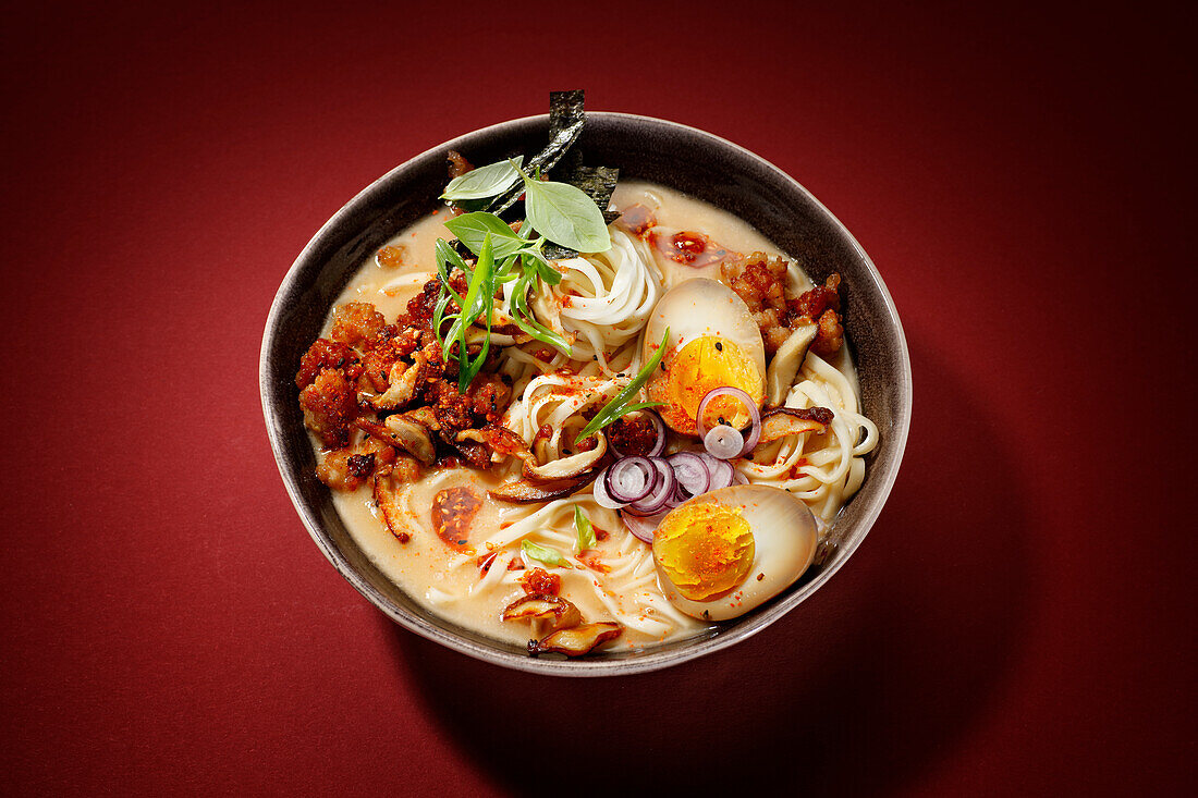 Miso soup with ramen noodles, ground pork and soy sauce egg