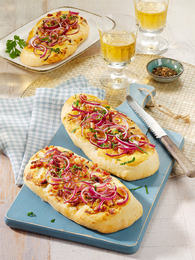 Tarte flambée ciabatta with bacon and red onions