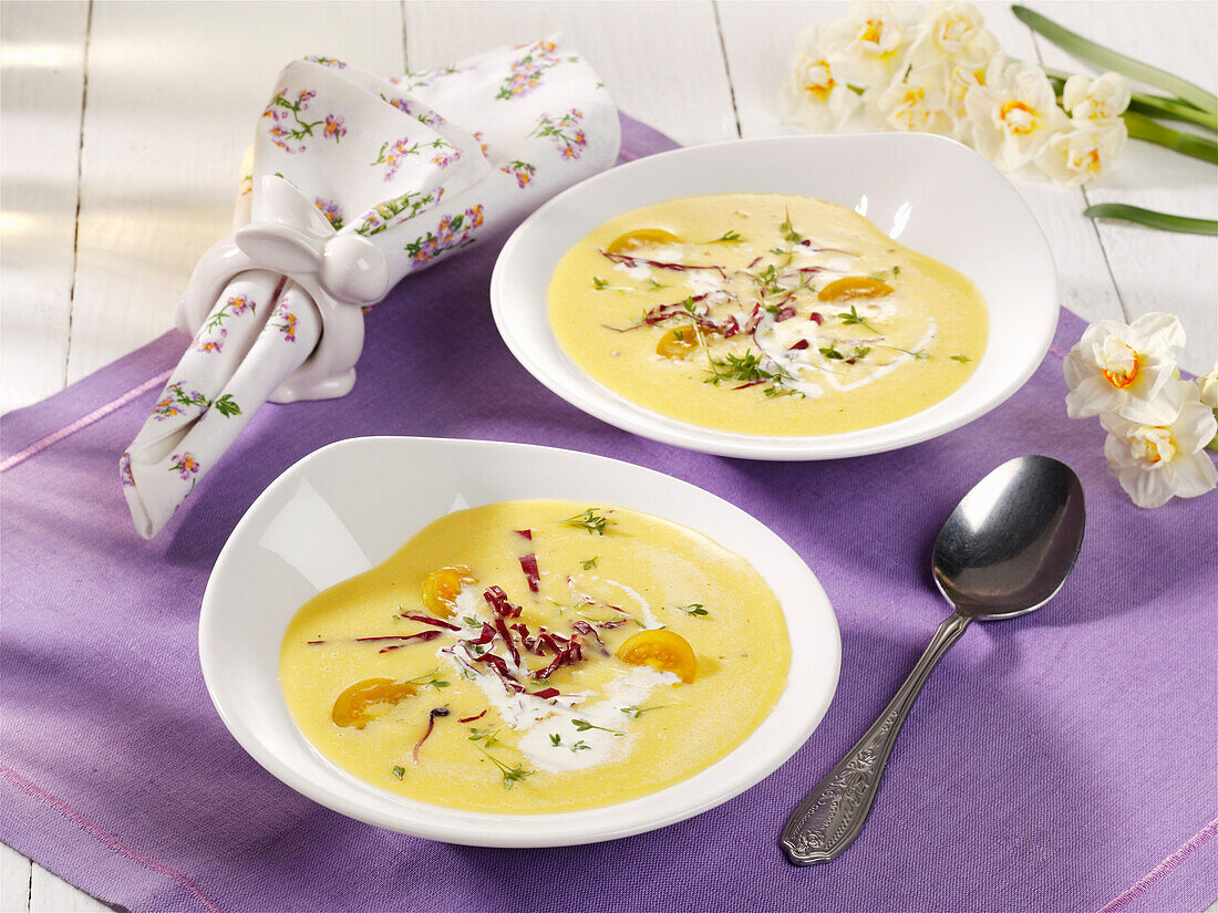 Yellow pepper soup with cherry tomatoes