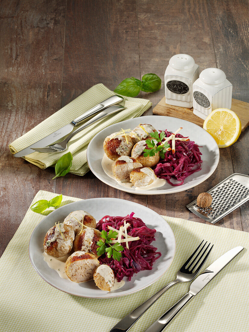 Meatballs with lemon and basil sauce and red cabbage