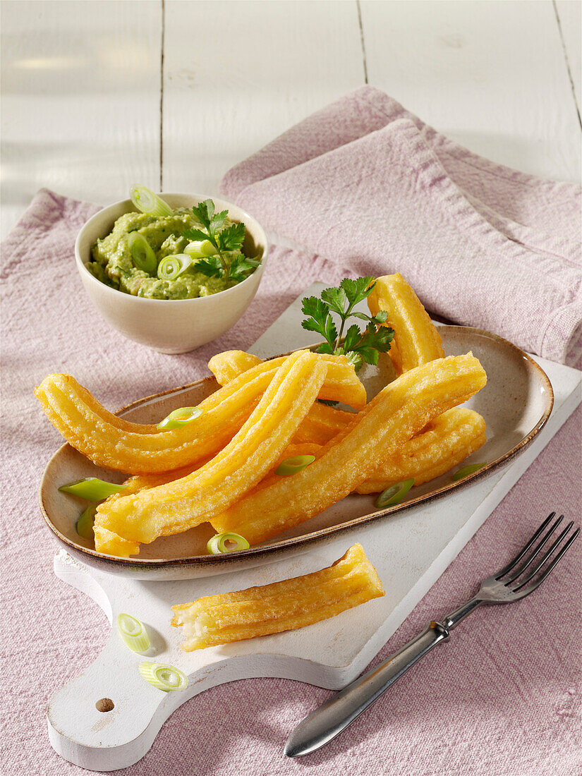 Potato churros with avocado cream