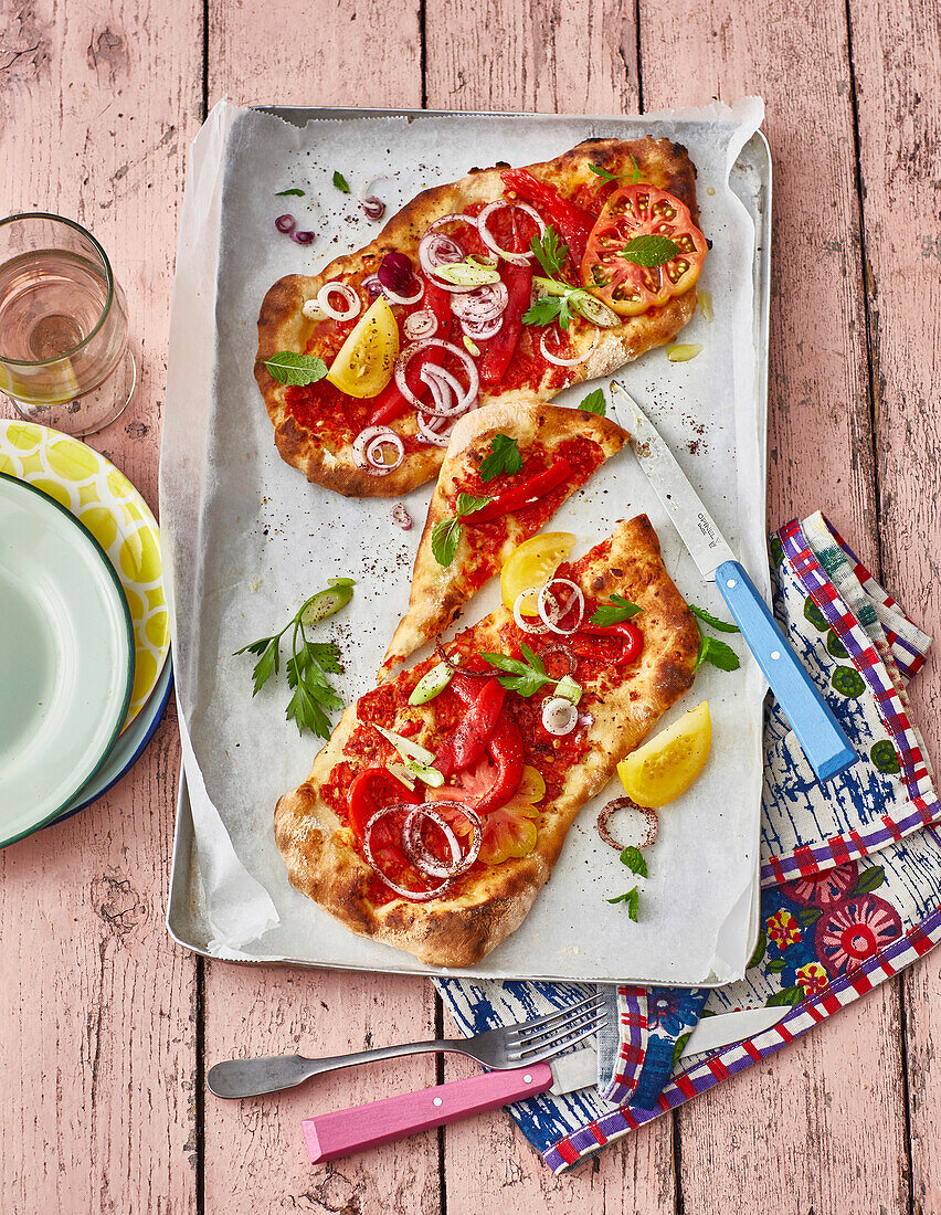 Vegan lahmacun with tomato and pepper topping