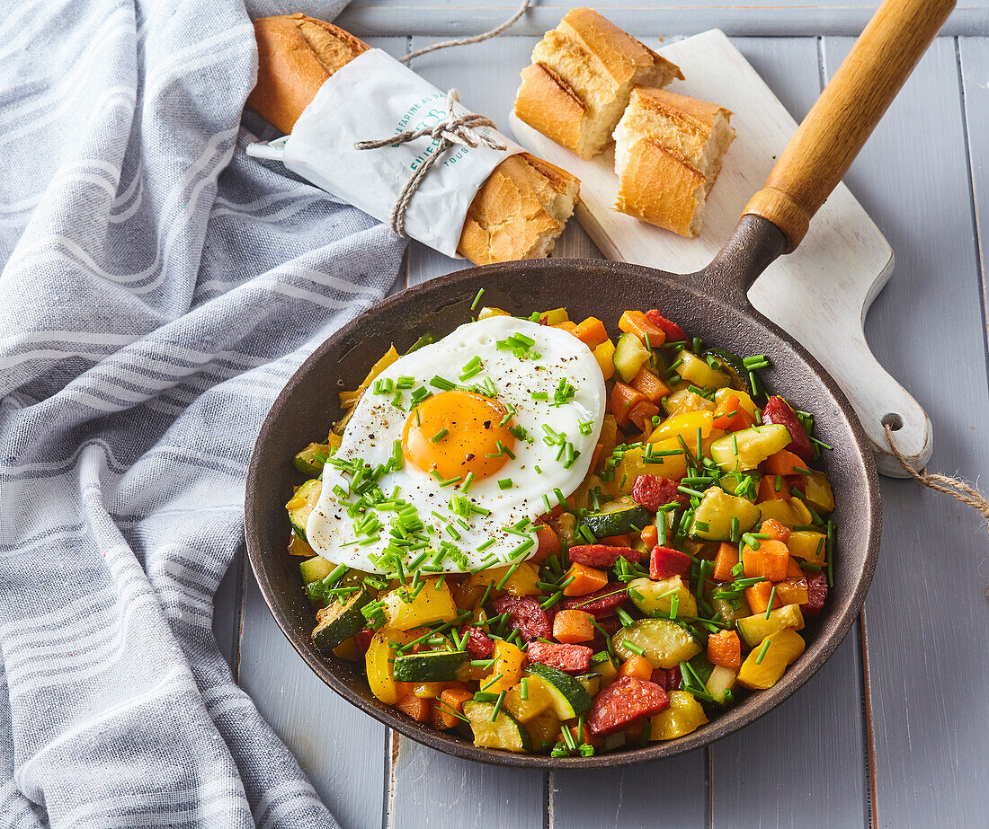 Vegetable and sausage skillet with fried egg