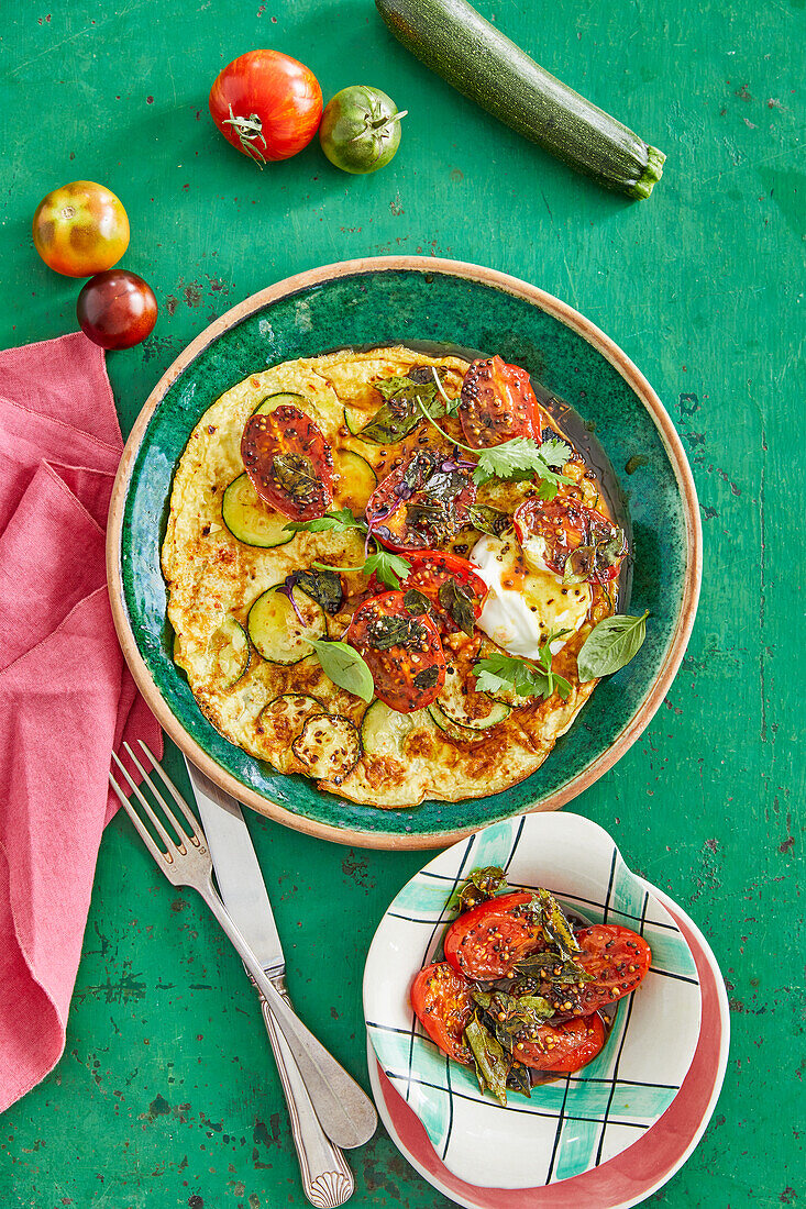 Spicy courgette omelette with roasted tomatoes