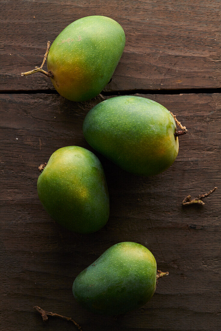 Mangoes on a wooden table